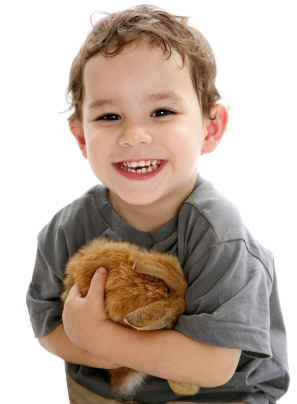 facts about rabbits: the best pet rabbit is a gentle one, as pictured by this happy boy and his pet rabbit